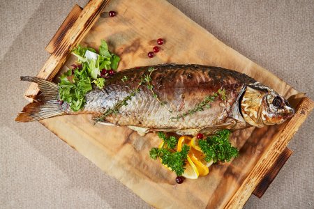 Речной сазан, печеный целиком с томатами, кабачками и сыром - Русское Подворье в Суздале